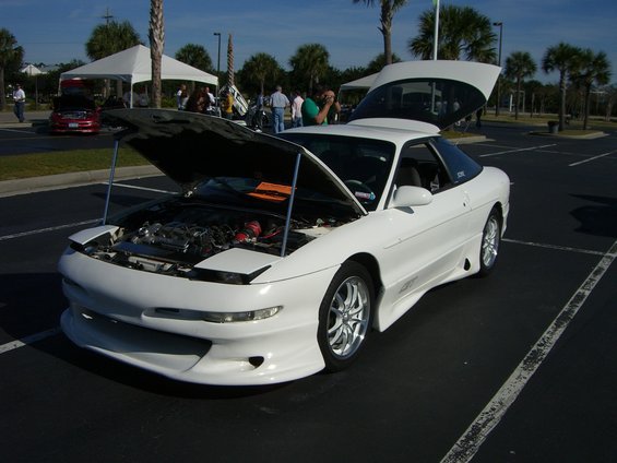 White 1996 Ford Probe with hood and trunk open, showing engine