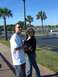 1996 Ford Probe - A man and woman pose for a photo in a sunny outdoor setting with palm trees and buildings visible.