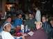 1996 Ford Probe - Several men are seated around a table at a restaurant, with menus open in front of them.