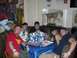 1996 Ford Probe - A group of friends gathers around a table, enjoying drinks and conversation in a uniquely decorated room.