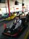 1996 Ford Probe - Go-karts lined up at a speed park, with a man in the foreground.