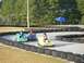 1996 Ford Probe - Go-karts race on a track with drivers enjoying the ride on a sunny day.