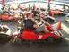1996 Ford Probe - Go-karts lined up at a track, with drivers seated and ready to race.