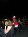 1996 Ford Probe - Several people are gathered at tables, with two individuals chewing on roses and one wearing a Canadian-themed hat.