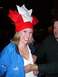 1996 Ford Probe - A woman wearing a festive red and white hat and a blue Puma jacket smiles for the camera, with a man's hand touching her chest.