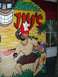 1996 Ford Probe - A person poses in a tropical-themed photo booth cutout with "Jim's" text visible.