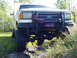 1989 Ford Bronco - This 1989 Ford Bronco is equipped with a heavy-duty brush guard and a prominent Confederate flag sticker on the front bumper.