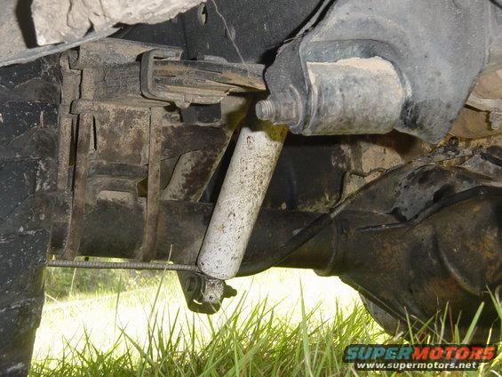Rear axle assembly with shock absorber and leaf spring