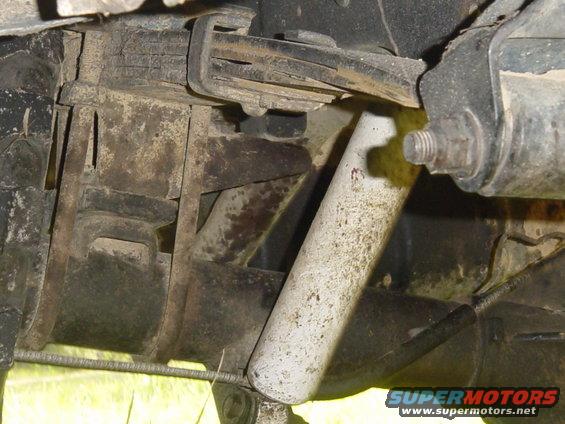 Close-up of rear suspension with leaf springs and shock absorber