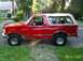 1992 Ford Bronco - This 1992 Ford Bronco is shown from the side, parked on a residential street.