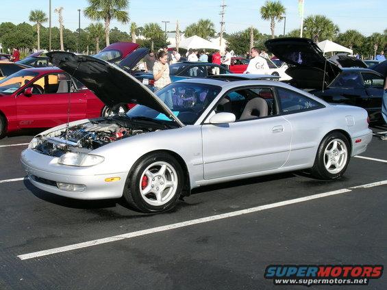 Silver coupe with hood open, showing engine. 1993 Mazda MX-6