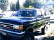 1989 Ford Bronco - This 1989 Ford Bronco is parked on a residential street, showing its 3/4 front profile.