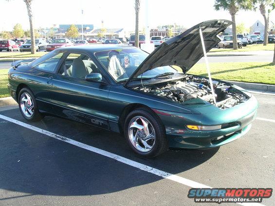 Green 1993 Ford Probe GT with hood open
