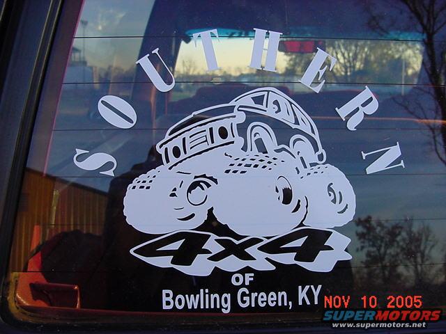 White sticker on rear window shows cartoon 4x4 truck with text 'SOUTHERN 4x4 OF Bowling Green, KY' and 'NOV 10, 2005 SUPERMOTORS'