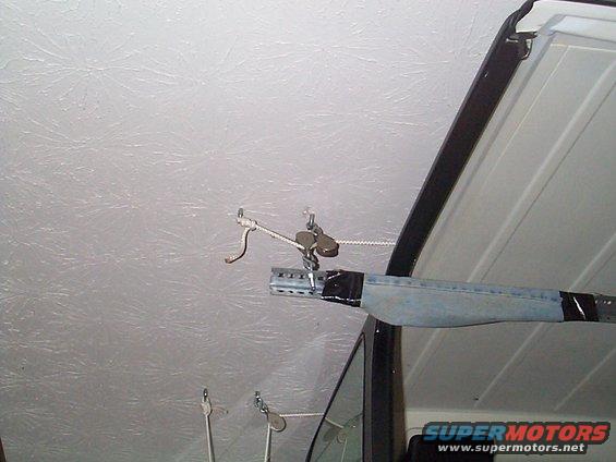All anchors in the ceiling are directly into the rafters which are 2X10's  

This is the hard anchored side (away from tie down on the wall) 
