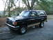 1988 Ford Bronco - This black Ford Bronco, likely a 1987 model, is shown from a three-quarter front angle.