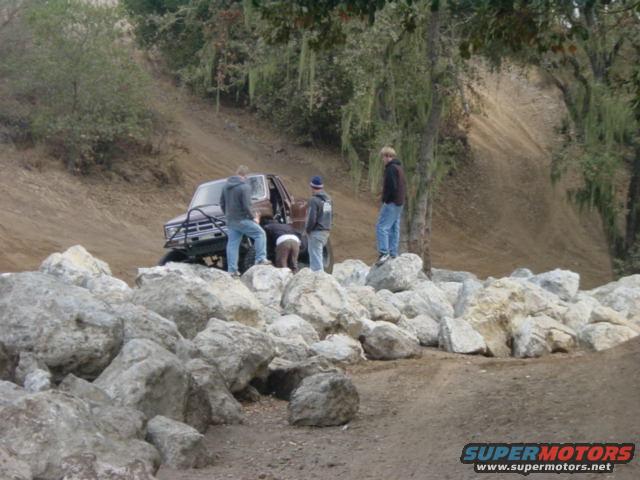 1986 Ford Bronco II on a rocky trail with people around it