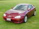 1993 Mazda MX-3 - The 1993 Mazda MX-3 coupe displays a distinctive body style and aftermarket modifications.