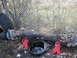 1979 Ford Bronco - Vehicle axle assembly on jack stands, with a drain pan and tire nearby.