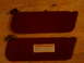 1994 Ford Bronco - Maroon sun visors are shown on a wooden surface.