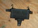 1994 Ford Bronco - Transmission cooler part shown against a wooden background.