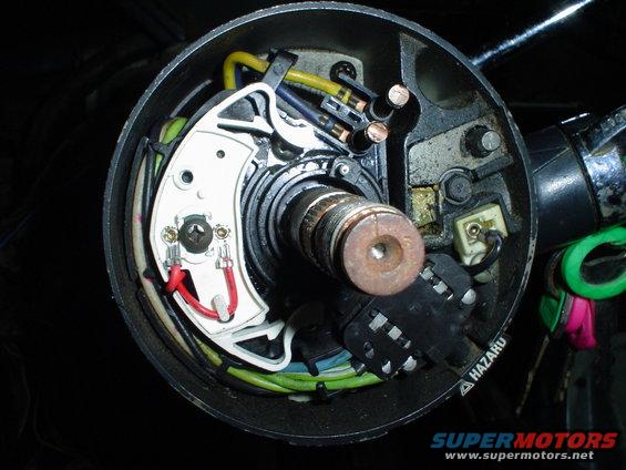 Steering column electrical components with wires and connectors visible