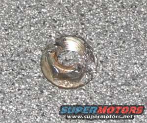 doom.jpg The stripped and destroyed nut of doom. This is why I cant really sell the torque converter from the old trans. 
This nut looked different than the other 3, maybe it was reused. The service manual says to buy new nuts and throw these away, maybe this is the reason.