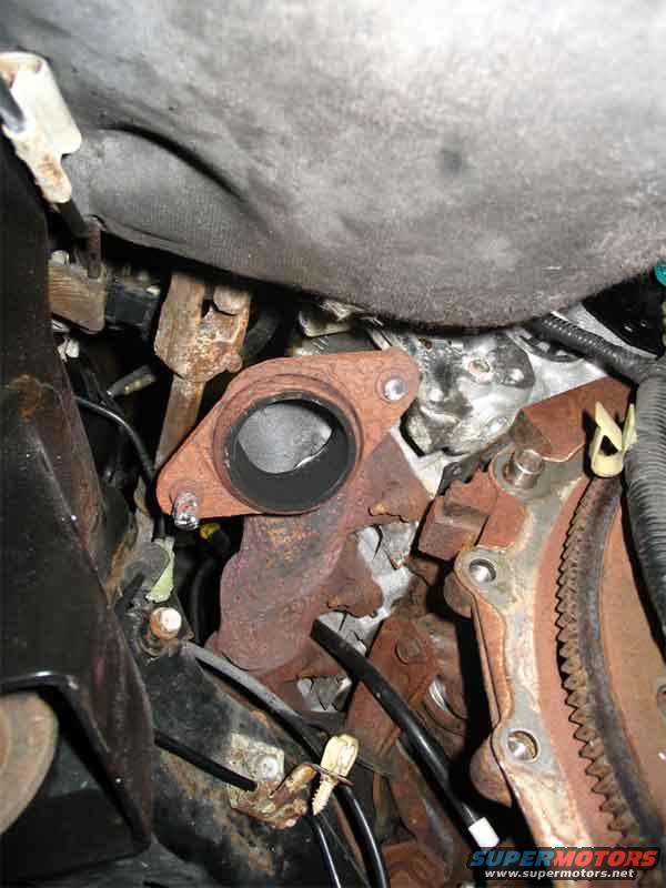 You have to remove the catalytic converters to get at the bolts on the trans. This is how one of them came off. First bolt broke, second one stripped. I was using the correct 15mm socket. Sucks to be me I guess.