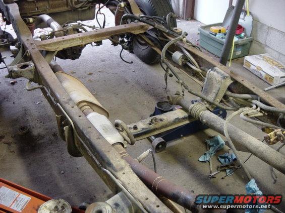 dsc00463.jpg Note the rear cab mount brackets just in front of the #3 crossmember.  They'll be gone soon.  They're not needed under the F-150 cab.