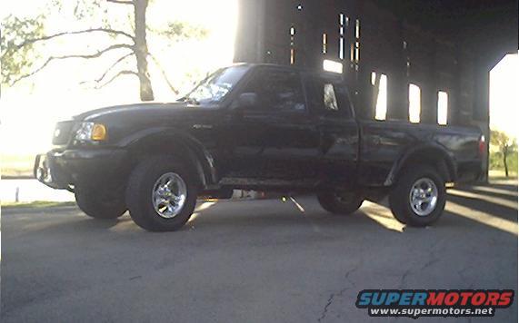 Black Ford Ranger pickup truck parked outside