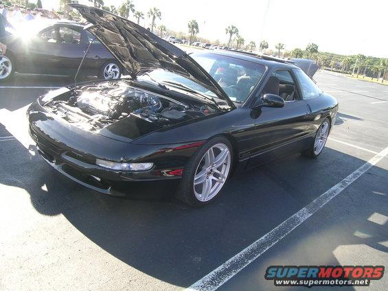 Black 1993 Ford Probe with hood open, 3q-front view