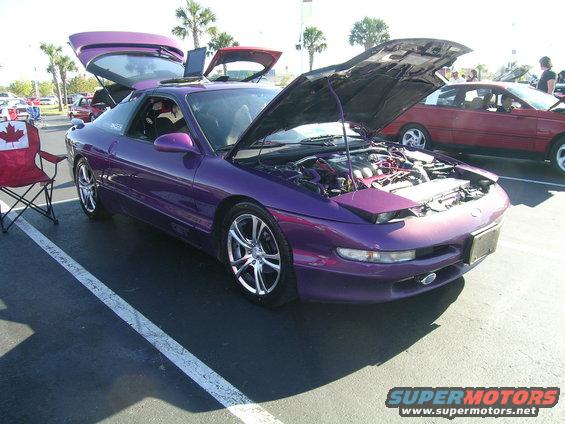 Purple Ford Probe with hood and doors open, front 3/4 view