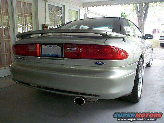 Silver 1993 Ford Probe rear quarter view, showing spoiler, taillights, and exhaust
