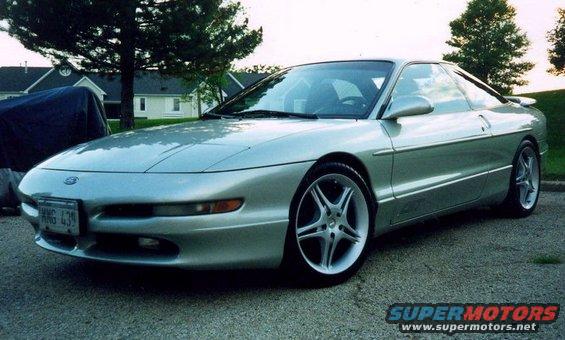 Silver 1994 Ford Probe coupe parked outside with custom wheels