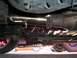 1997 Ford Probe - The underside of a vehicle shows the exhaust system, including a catalytic converter and muffler.
