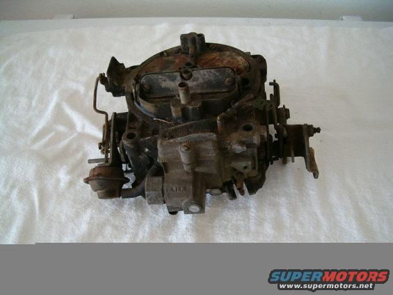 Used carburetor with visible rust and dirt, labeled "FILTER"