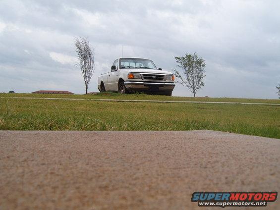 White 1997 Ford Ranger front view parked on a grassy hill