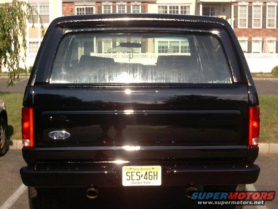 Rear view of a black Ford Bronco with a New Jersey license plate SES-46H