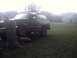 1996 Ford Bronco - This 1996 Ford Bronco is seen from a 3/4 front angle, parked on a grassy area next to a tree.