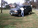 1996 Ford Bronco - A 1996 Ford Bronco is parked on a grassy area next to a person.