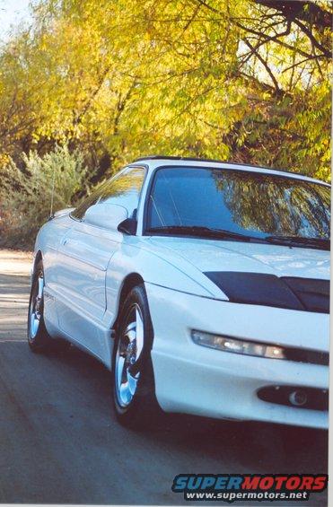 White 1996 Ford Probe 3q-front view with black hood accent