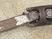 1989 Ford Bronco - This image shows a close-up view of a driveshaft U-joint, a critical component in vehicle power transmission.