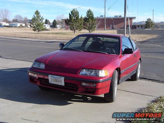 91crx2.jpg Attempted to clean up the hood and touch up the paint.  She will get a carbon fiber one and a paint job next spring.