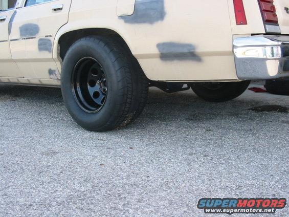 1985 Ford Crown Victoria LTD rear wheel and fender, showing primer spots on body