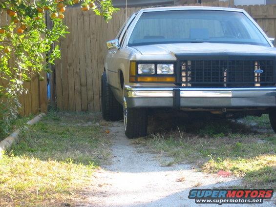 1985 Ford Crown Victoria LTD front view, parked on gravel path