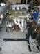 1996 Ford Probe - Mazda V6 engine removed from a vehicle and mounted on an engine stand for repair or rebuilding.