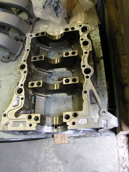 Engine block casting with bearing caps installed