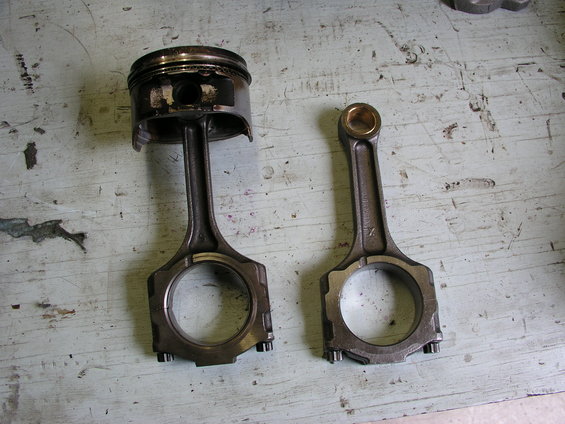 Piston and connecting rod assembly, one used and one new
