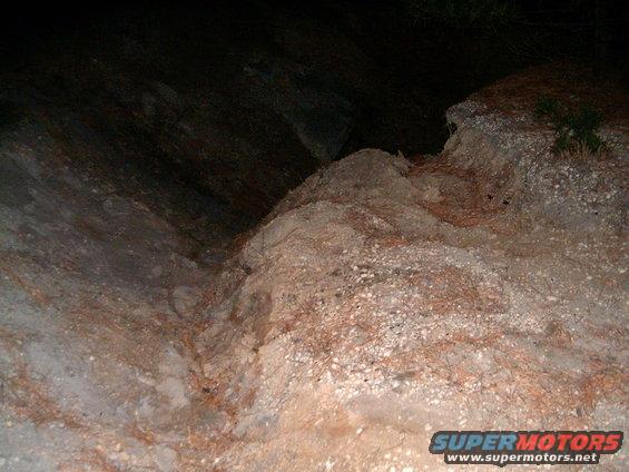 rocky ground with some sparse vegetation
