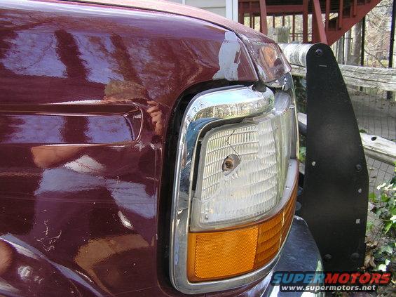 Took out the headlight, corner light, chrome trim, header panel and bent the fender and hood.